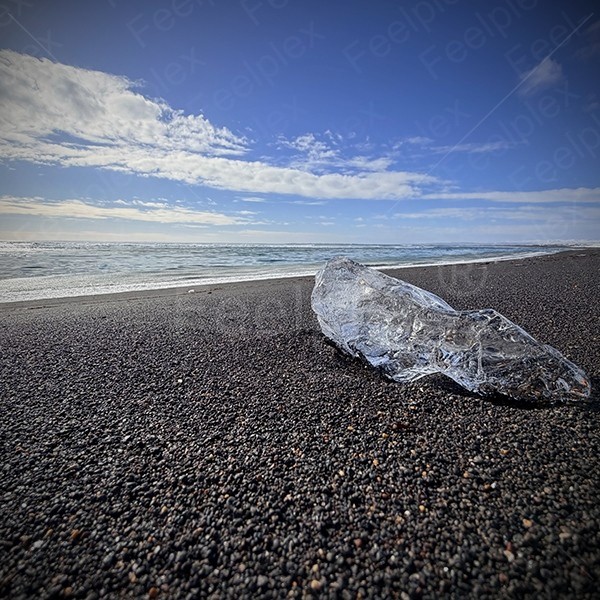 Scraping waves on sandy ground at Black Sand Beach in Iceland