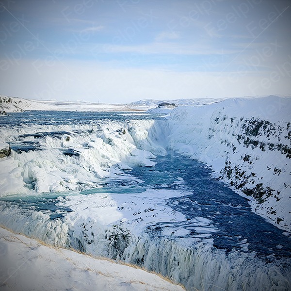 Gullfoss Waterfall with snow and rushing water